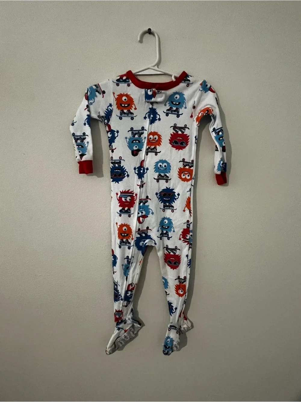 Carter's White Footed One-Piece Pajamas with Red Trim and Blue & Orange Monsters